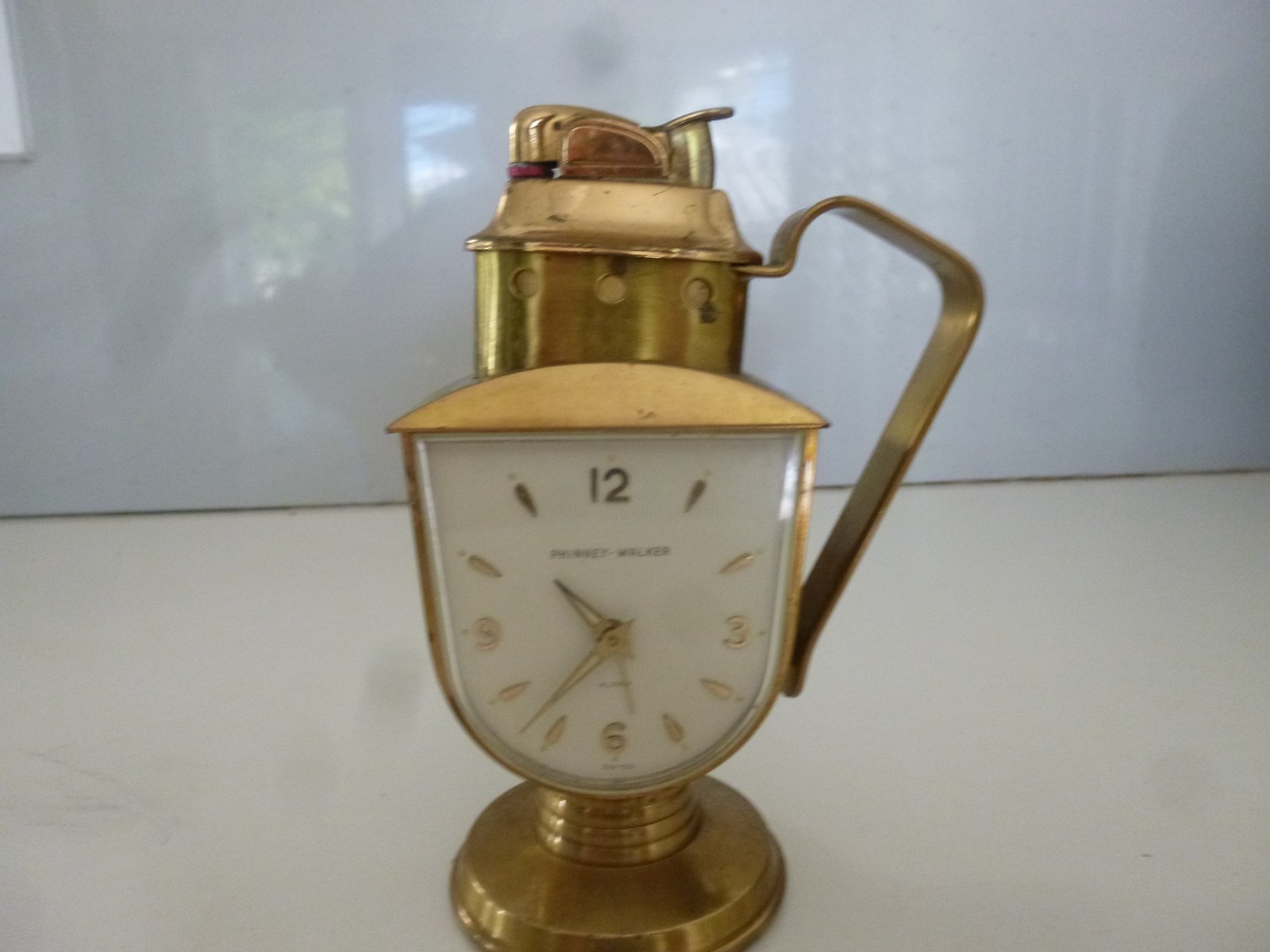 Vintage rare Phinney Walker/ Evans Combo clock & table lighter.Working