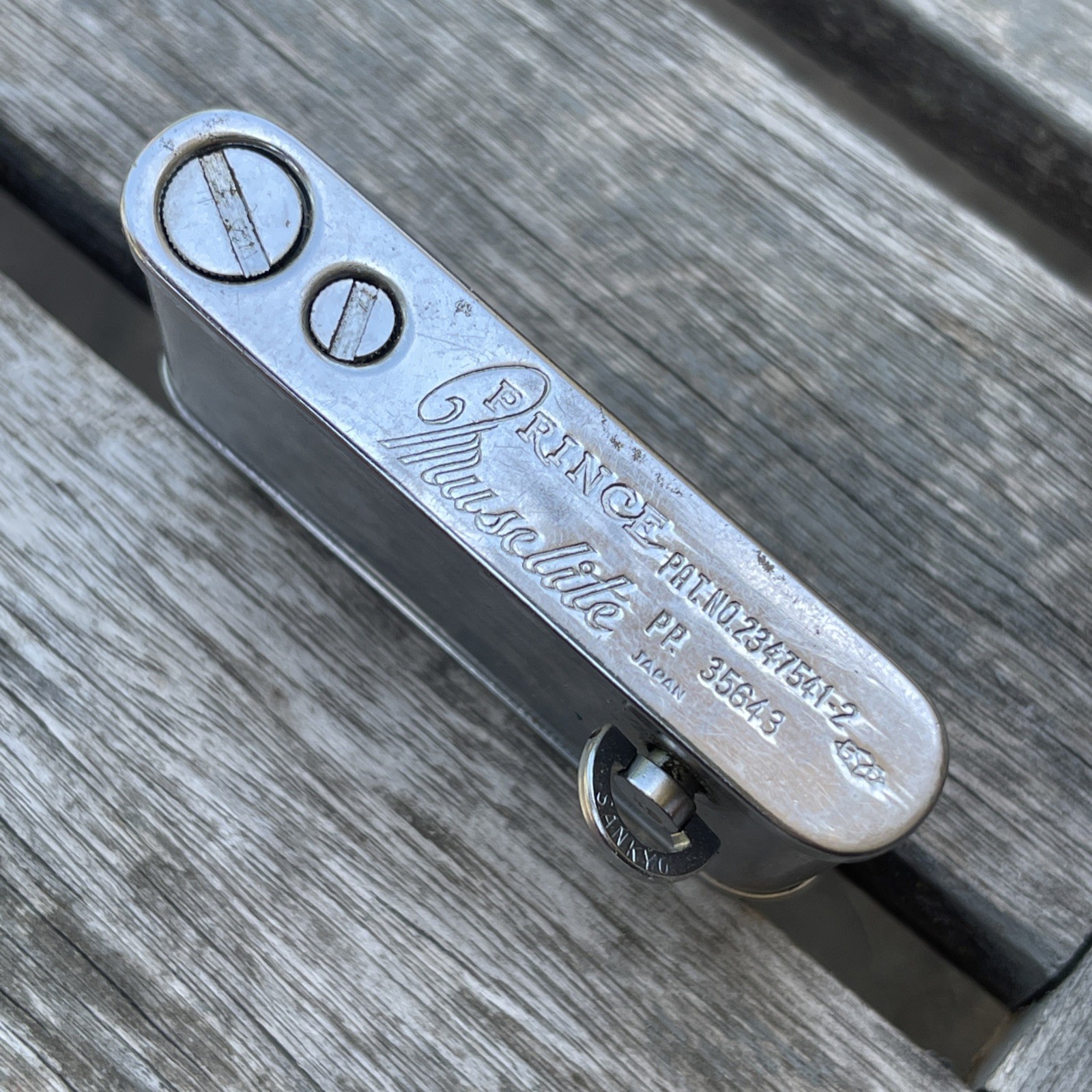 Vintage Prince Chrome Muselite Lighter Wind Up Musical As-is