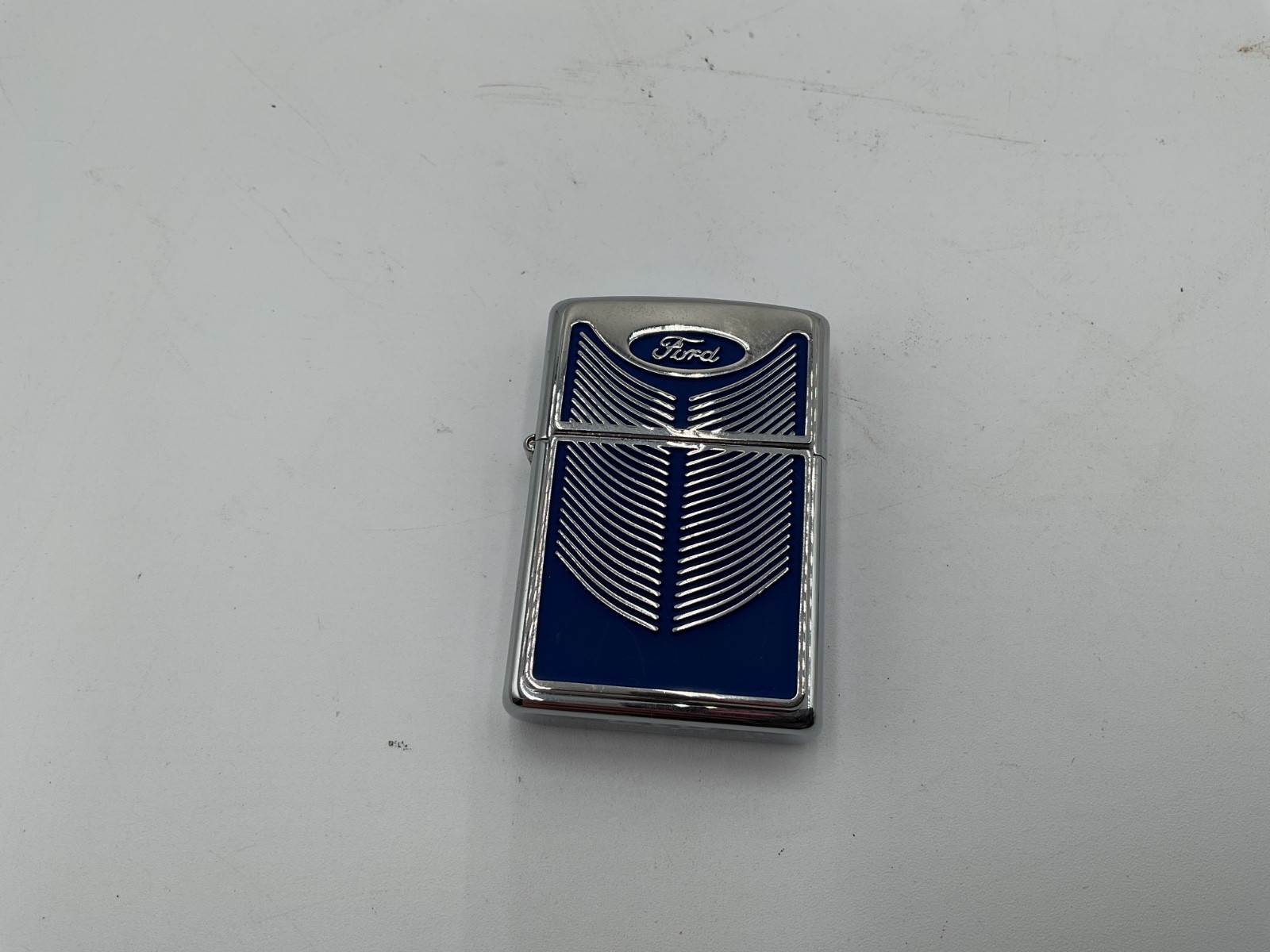 ZIPPO 2003 FORD GRILL BLUE EMBLEM POLISHED CHROME LIGHTER UNFIRED.
