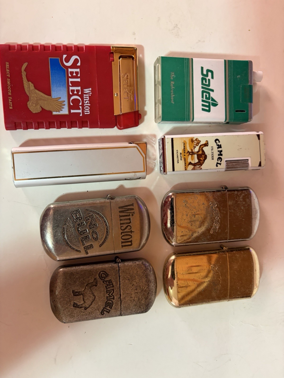 EIGHT Different Collectable Cigarette Lighters – Used but Works