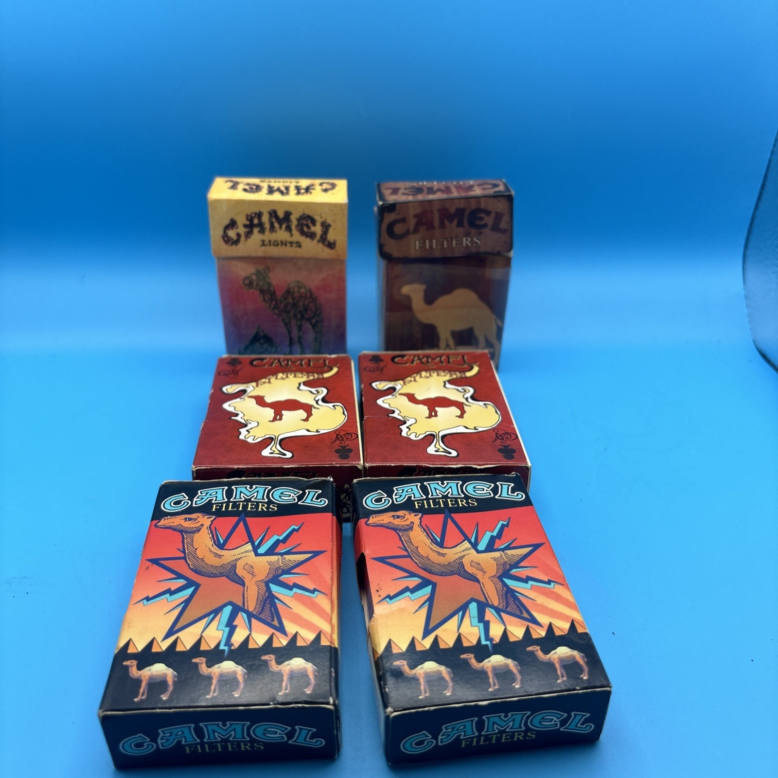 6 Empty Camel Artist Vintage Cigarette Packs , 3 Flip Tops And 4 Slide Packs