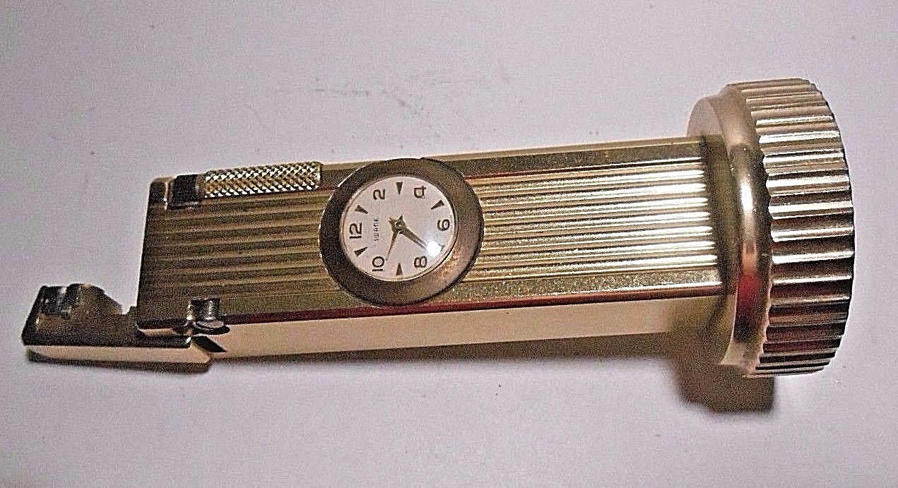 VINTAGE CYGNUS LIFT ARM TABLE LIGHTER WORKS WITH SWANK CLOCK. WIND STEM MISSING