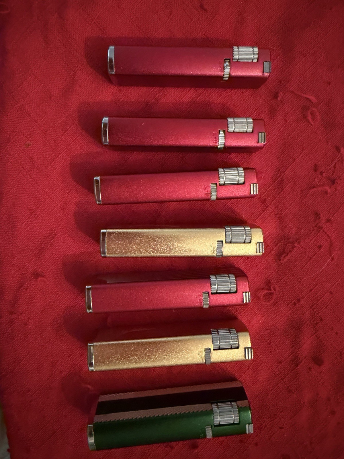 Lot of 7 Vintage JJJ Super Thin Slim Gas Pocket Lighters Gold Red and Green.