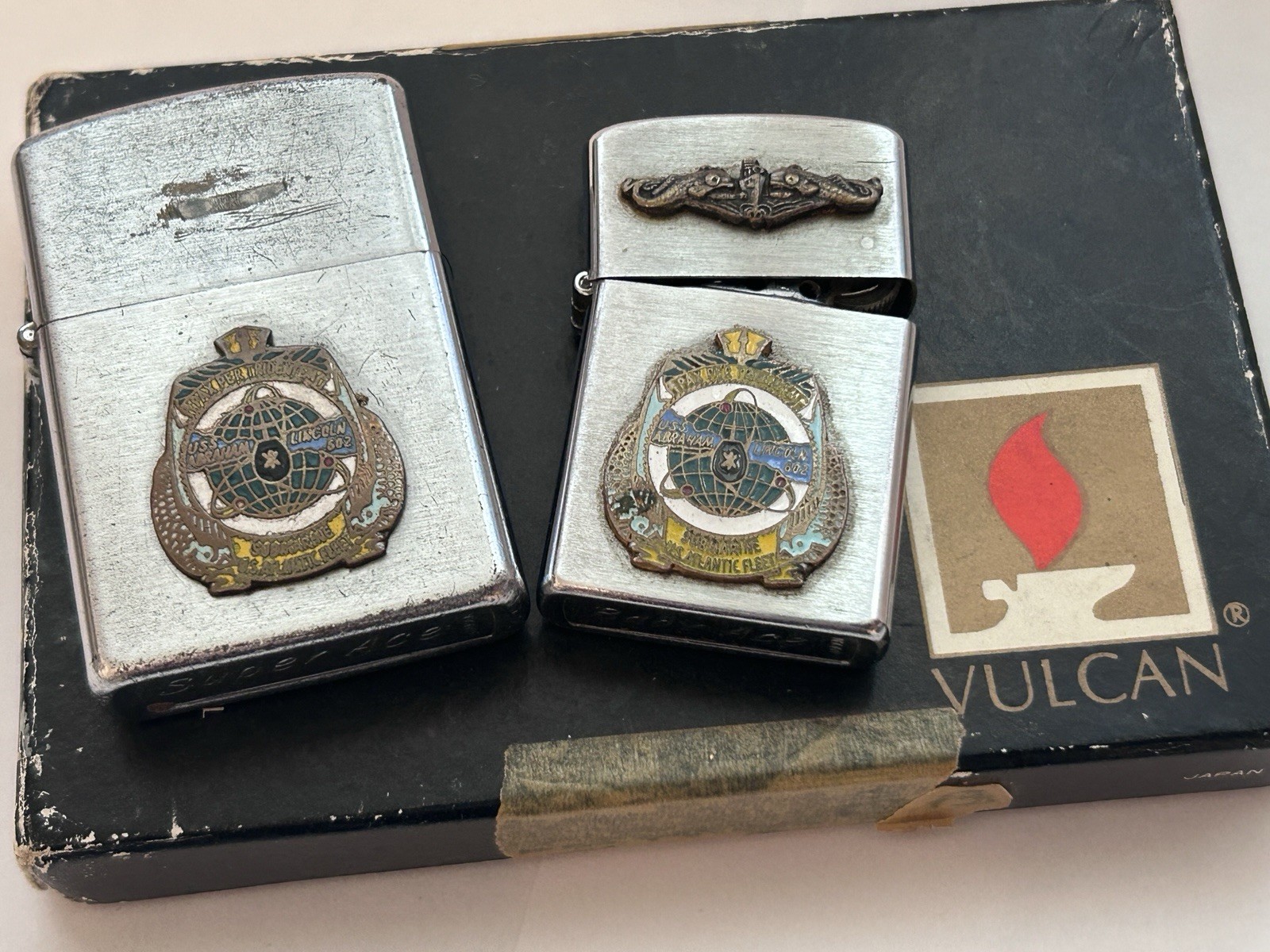 US Navy USS Abraham Lincoln 602 Super Ace and Baby Ace Vulcan lighters 1960s