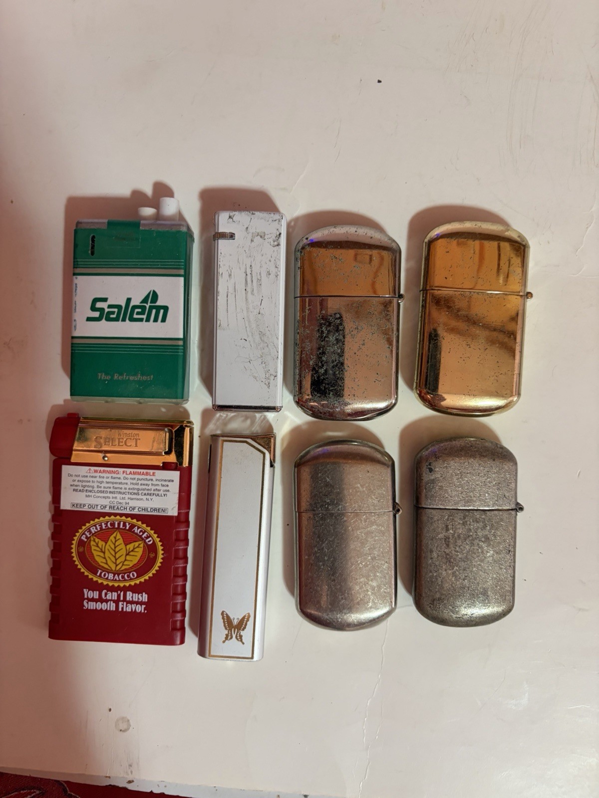 EIGHT Different Collectable Cigarette Lighters – Used but Works
