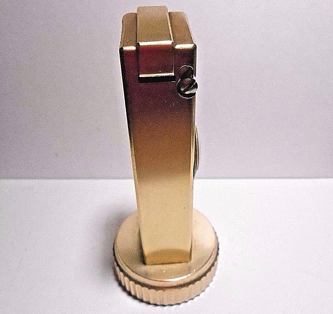 VINTAGE CYGNUS LIFT ARM TABLE LIGHTER WORKS WITH SWANK CLOCK. WIND STEM MISSING