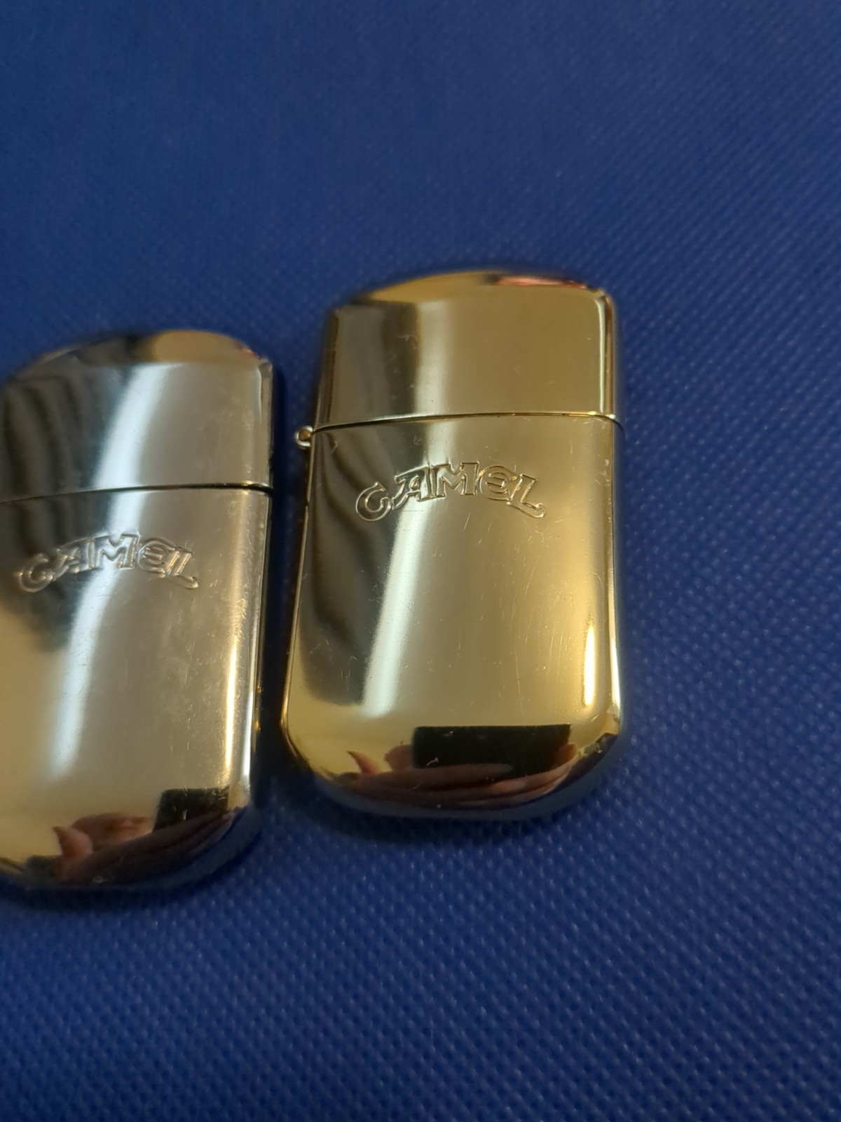 LOT OF 2 VINTAGE CAMEL BRANDED METAL FLINT LIGHTERS SILVER AND GOLD NEVER USED