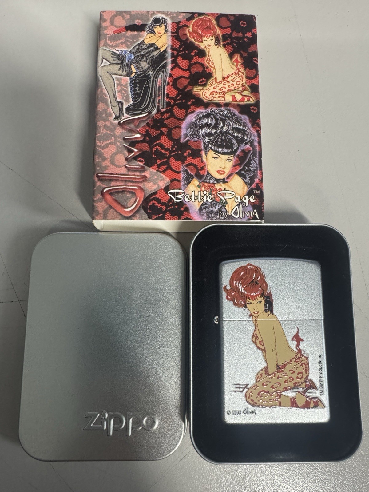 ZIPPO 2003 OLIVIA BETTIE PAGE SHE DEVIL PINUP GIRL LIGHTER SEALED IN BOX G185