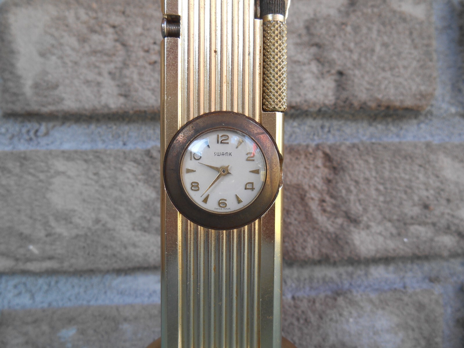 VINTAGE CYGNUS LIFT ARM TABLE LIGHTER WORKS WITH SWANK CLOCK. WIND STEM MISSING
