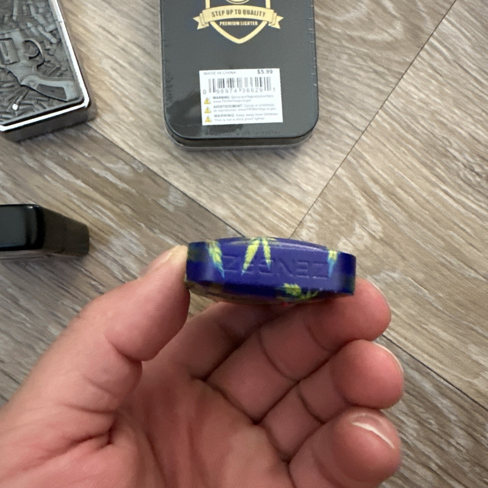 A set of 4 lighters with a pattern.