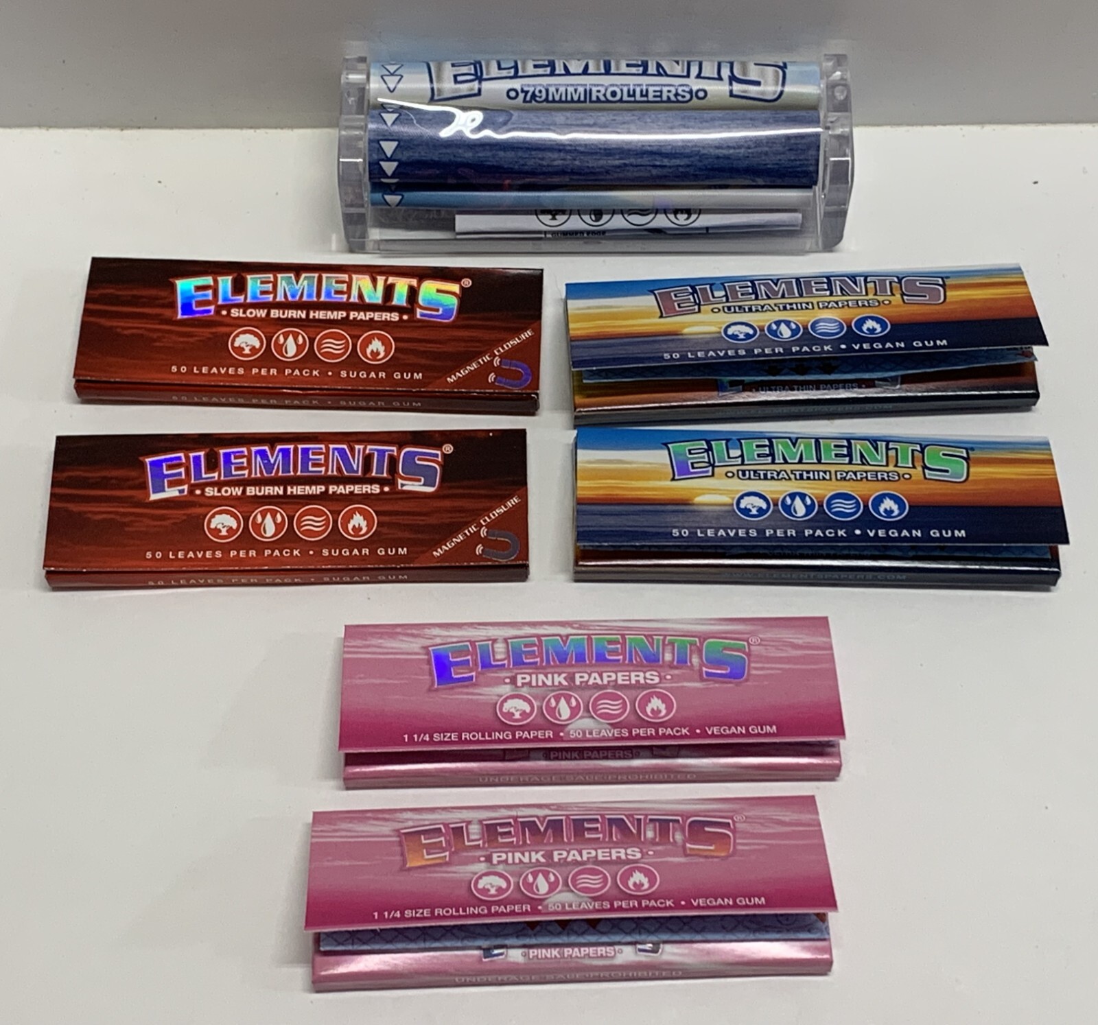 ELEMENTS 1 1/4 ROLLING PAPERS SAMPLER 6 PKS 2 RED 2 BLUE 2 PINK+ 79MM ROLLER