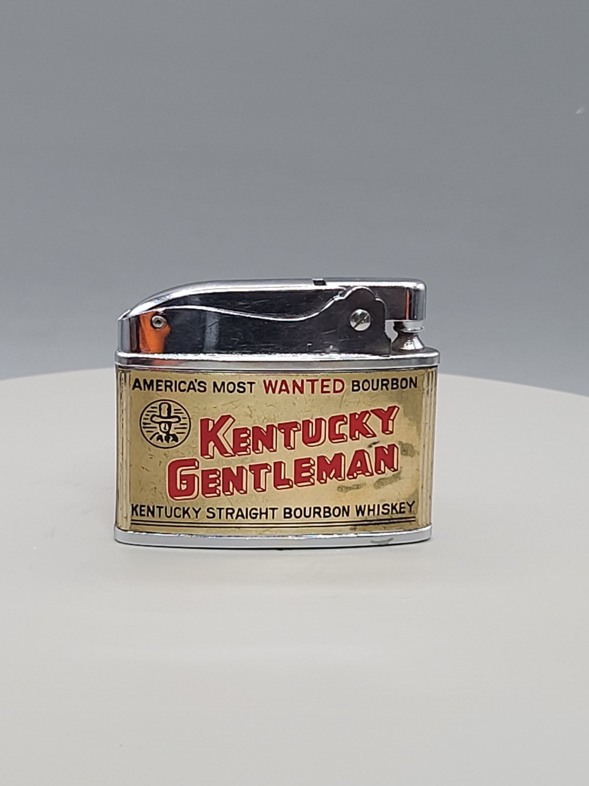 Vintage Kentucky Gentleman Bourbon America’s Most Wanted Flat Ad Petrol Lighter