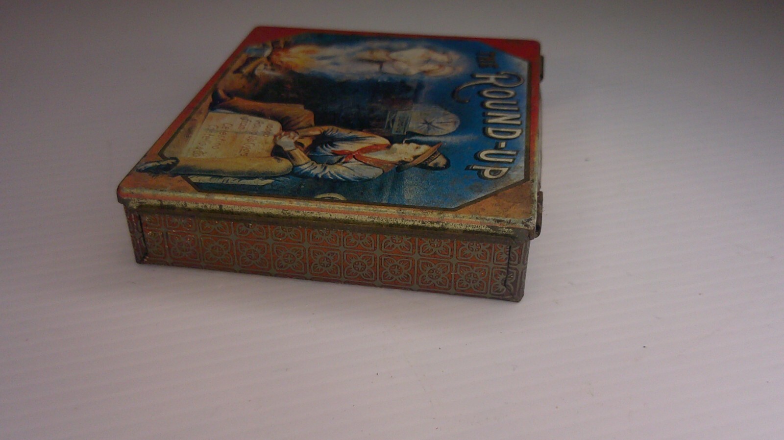 vintage advertising empty tin Round up cigarettes ghost figures in smoke Z131