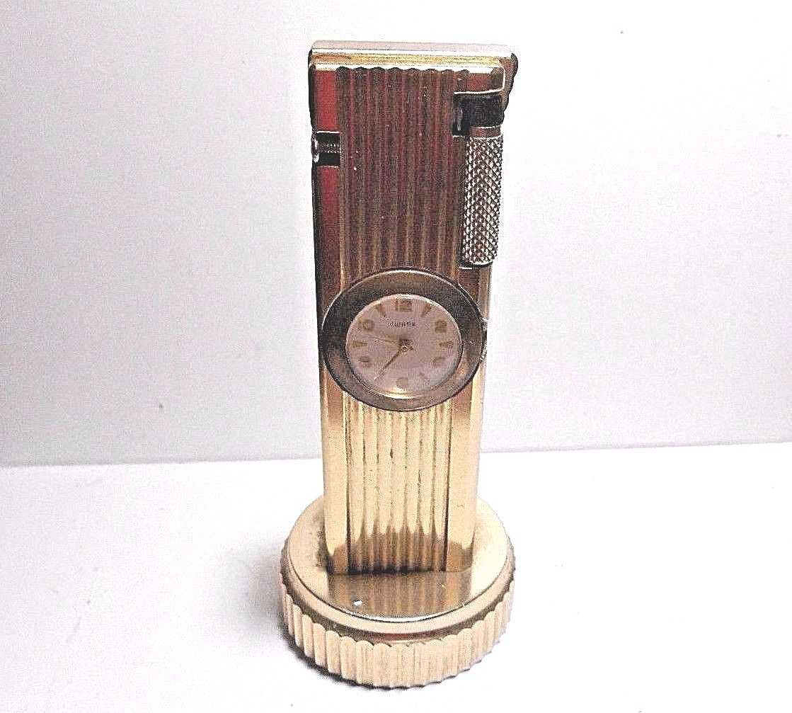 VINTAGE CYGNUS LIFT ARM TABLE LIGHTER WORKS WITH SWANK CLOCK. WIND STEM MISSING