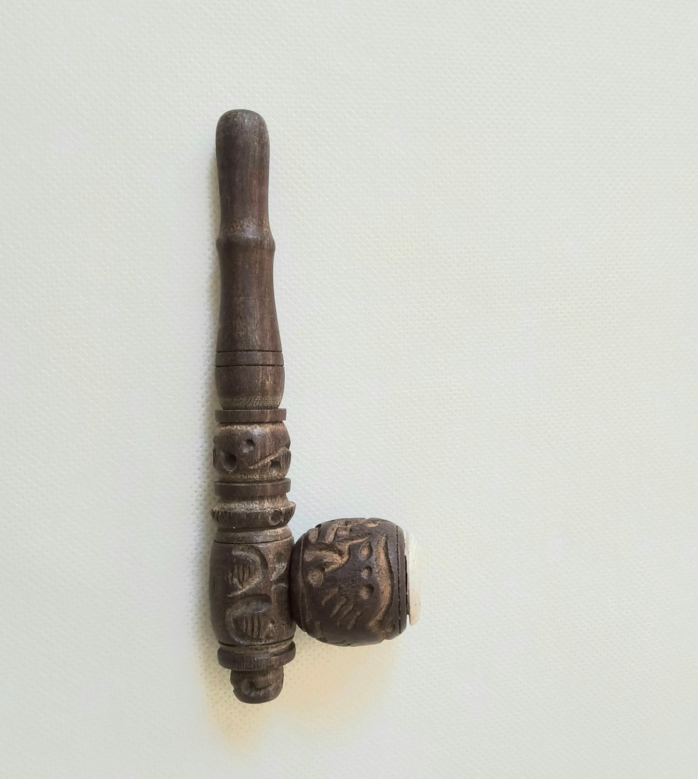 “Handcrafted Wooden Smoking Pipe with Intricate Carvings