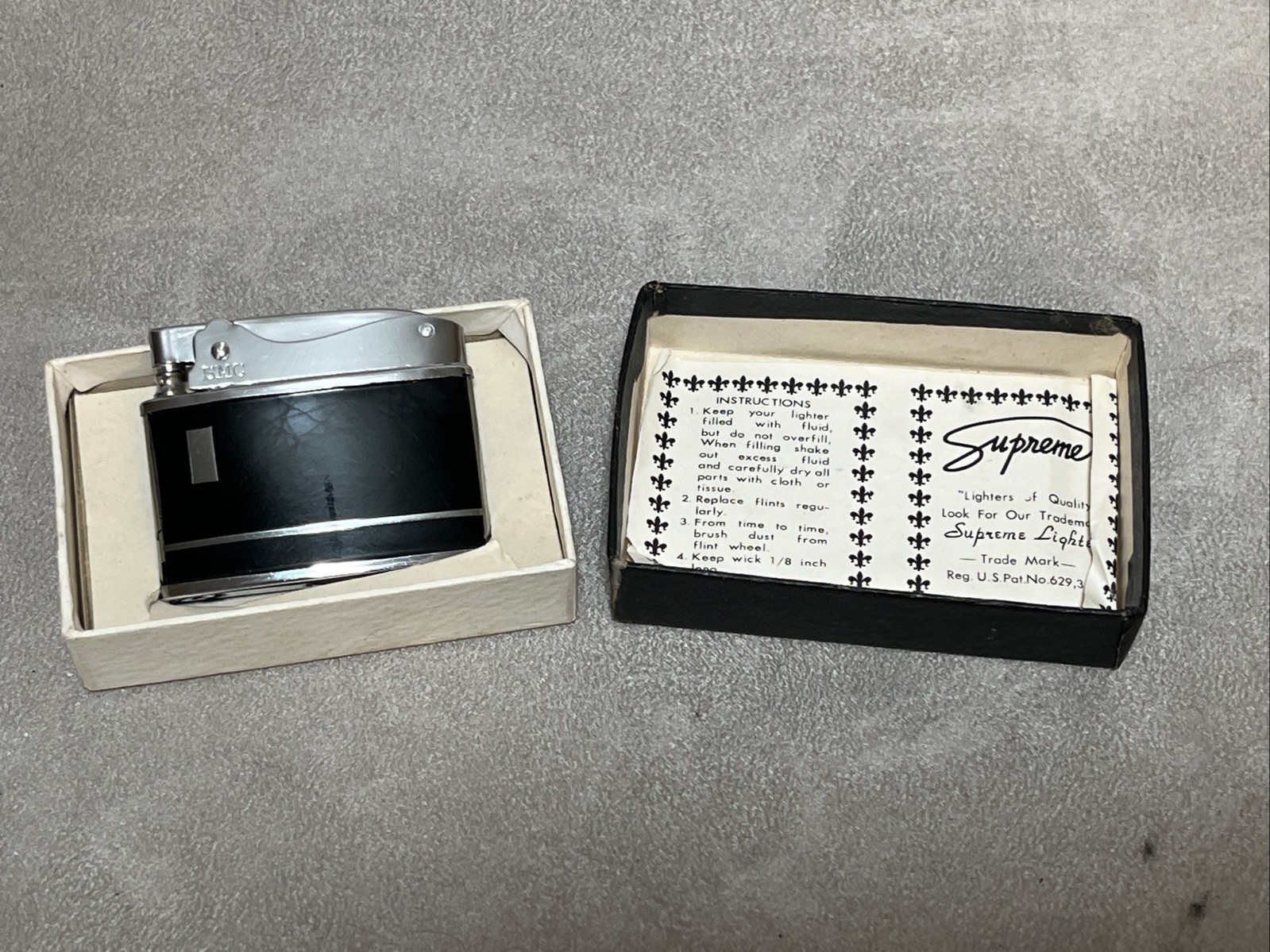 Vintage SMC Supreme slim/flat chrome & black enamel lighter. New old stock Works