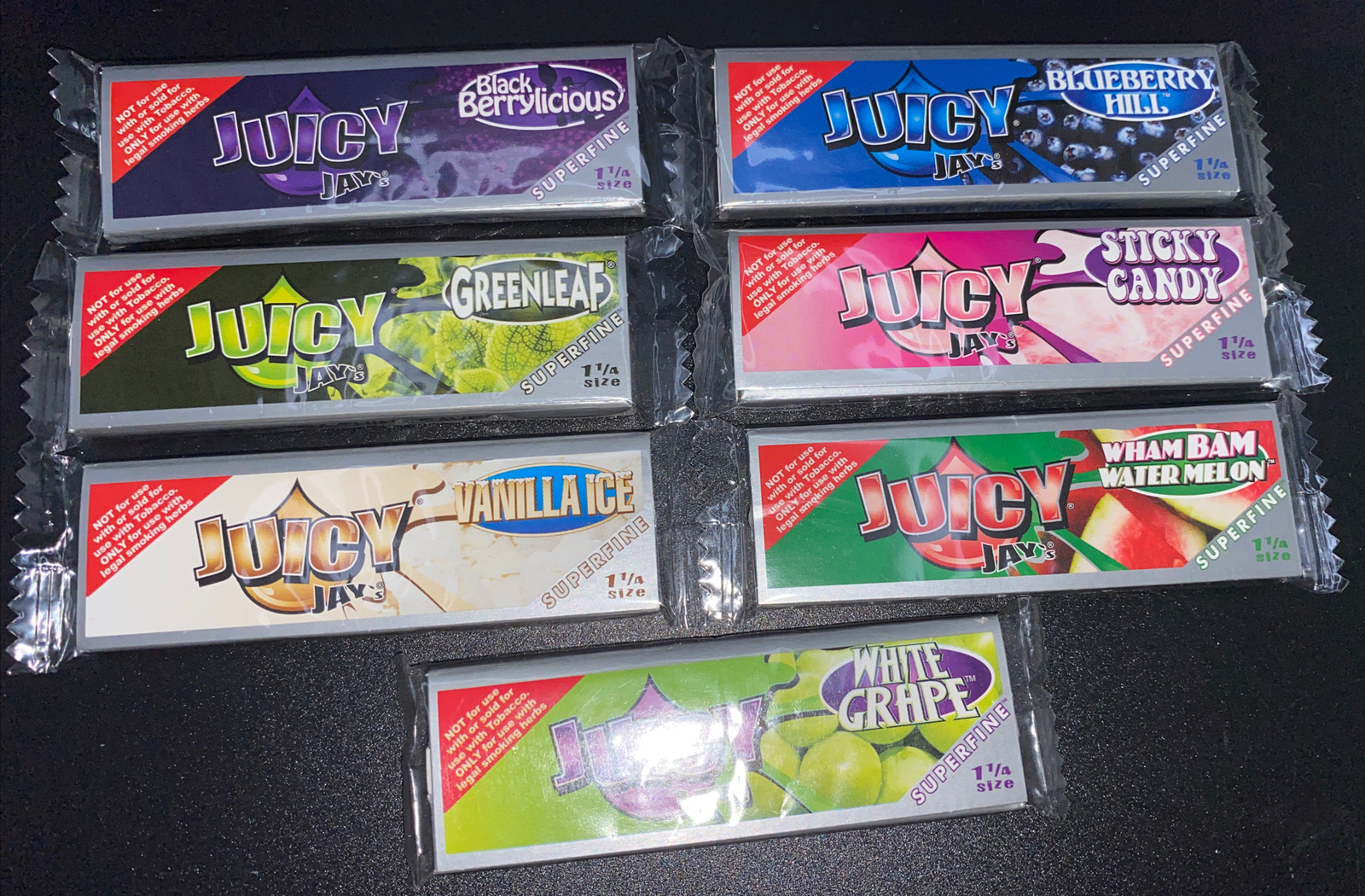 Juicy Jay’s 1 1/4 Rolling Papers Variety Sampler 7 Pack (The Super Fine)