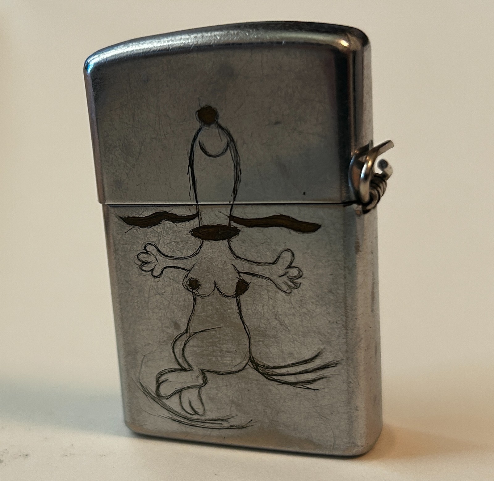 Vietnam-era Vulcan lighter, sexy dancing Snoopy USS Abraham Lincoln, late 1960s