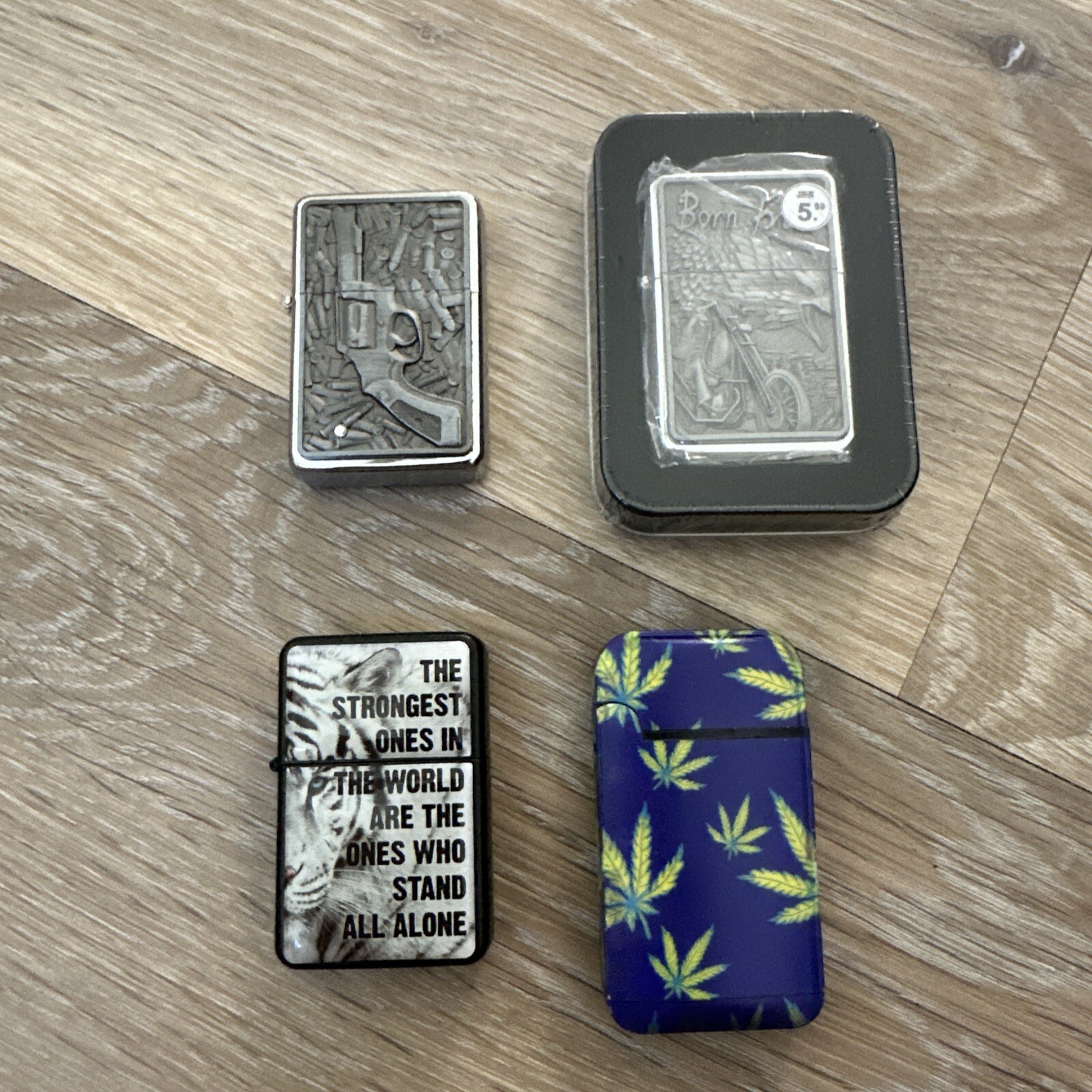 A set of 4 lighters with a pattern.