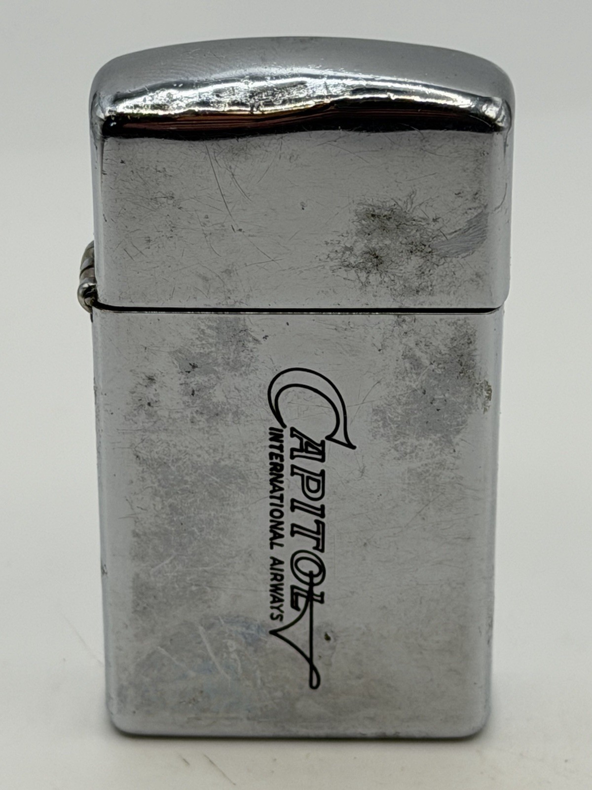 Vintage 1967 Capitol Airways Advertising High Polish Chrome Slim Zippo Lighter