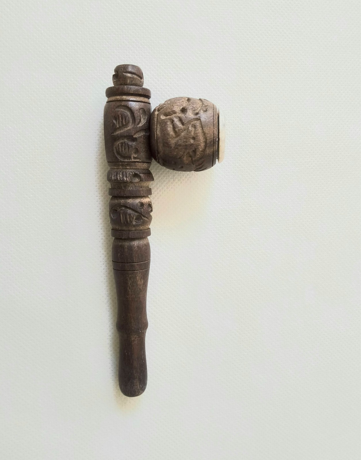 “Handcrafted Wooden Smoking Pipe with Intricate Carvings
