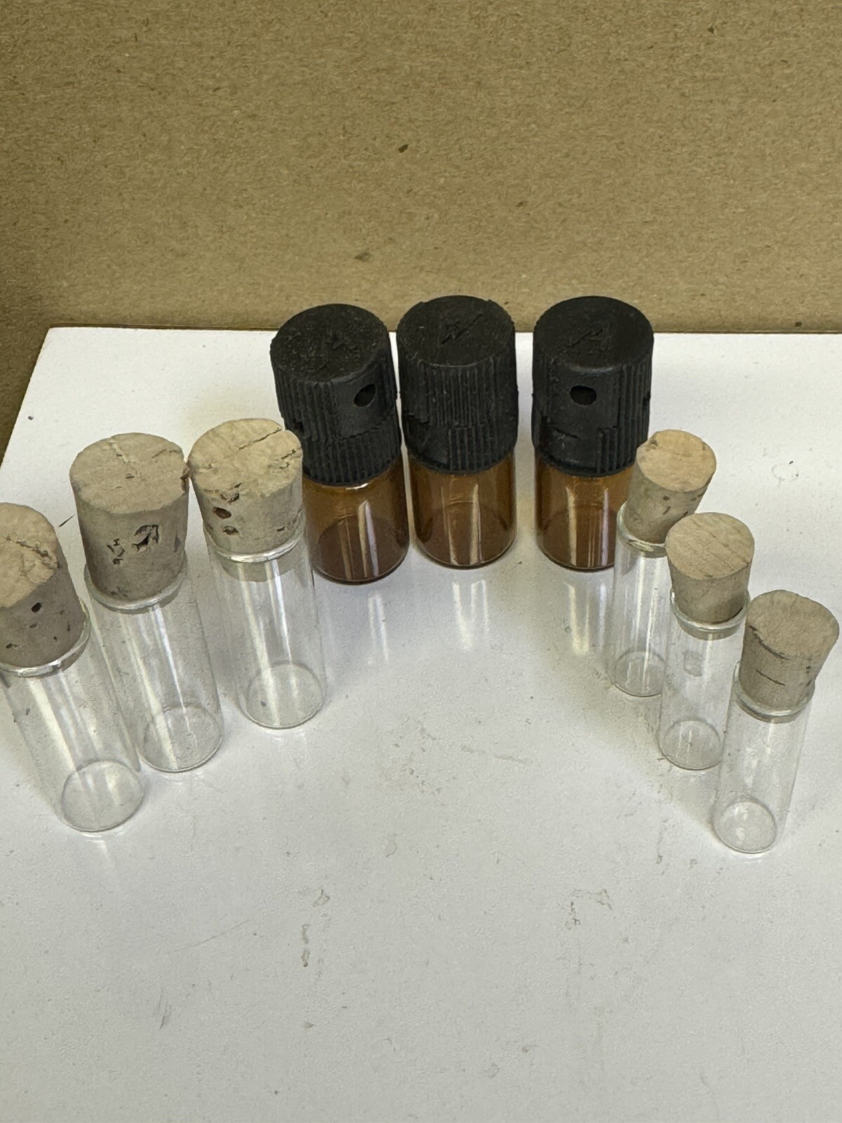 Lot of 9 Clear and amber Glass Vial Clear Cork plastic Top Vintage / New