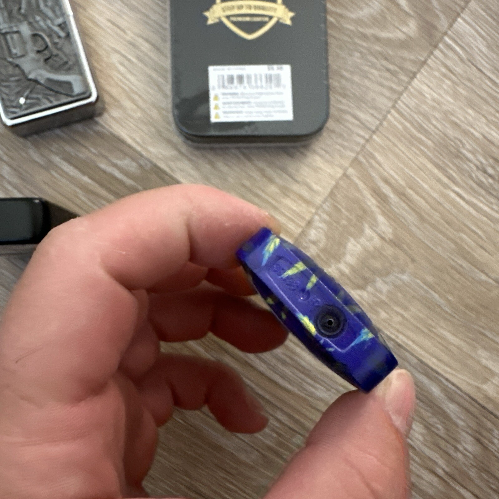 A set of 4 lighters with a pattern.