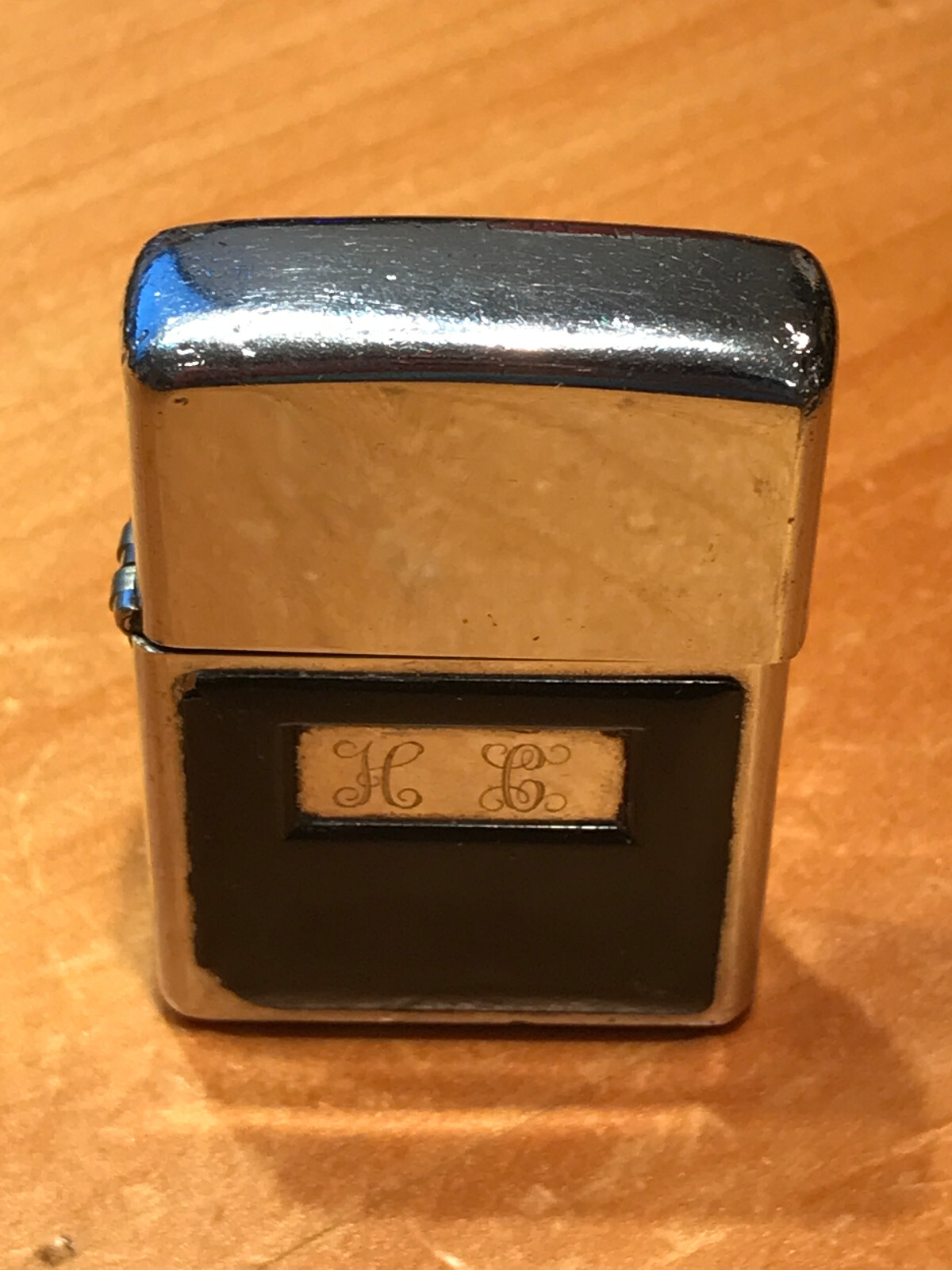 VINTAGE BRUSH CHROME BLACK PANELS ZIPPO LIGHTER WITH ENRAVING H C ON THE FRONT