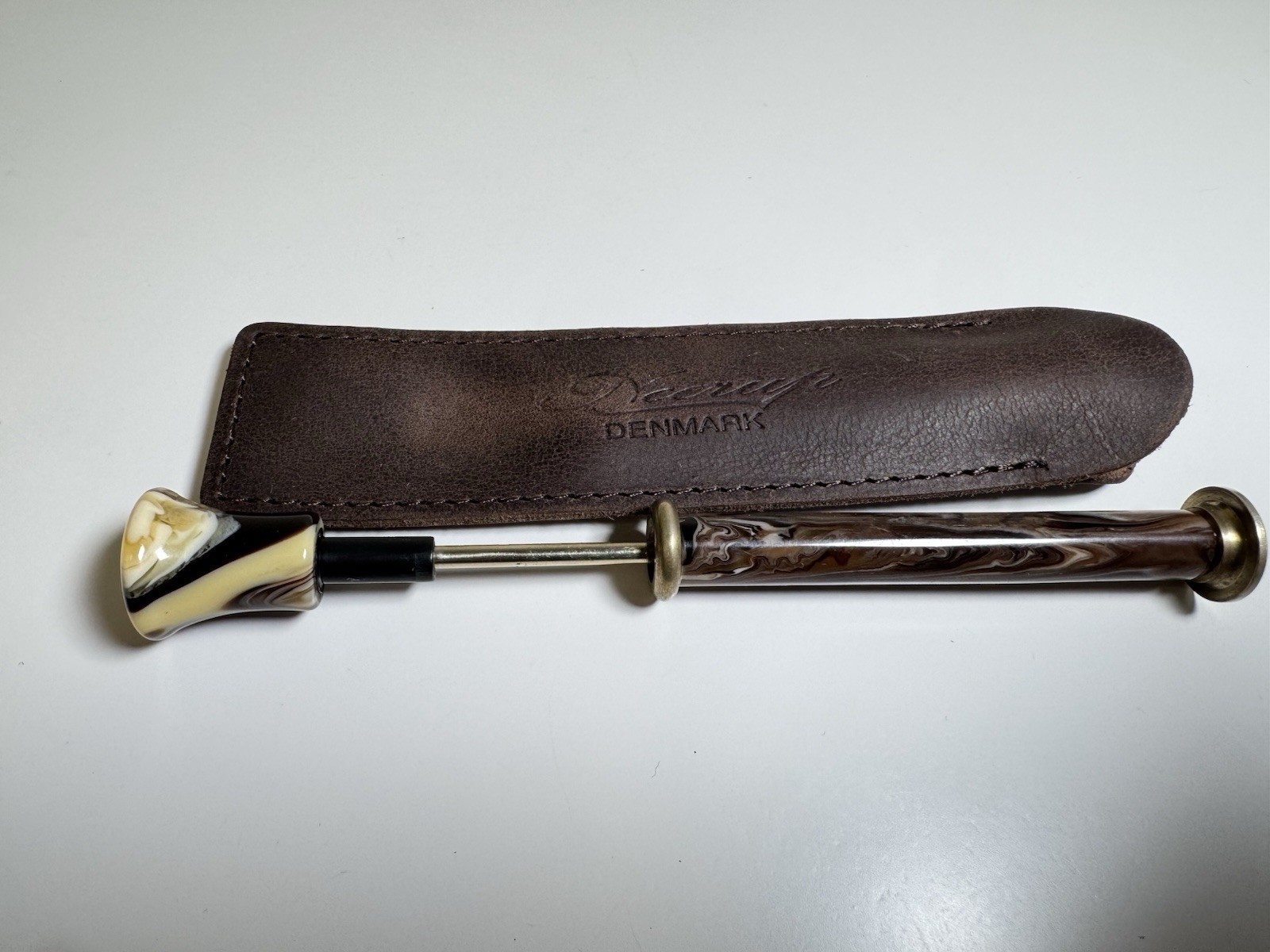 neerup pipe tamper tool in genuine brown leather pouch made in denmark