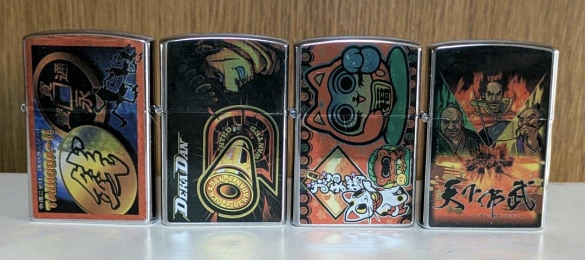 Set of 4 metal oil lighters with oil lighter artwork