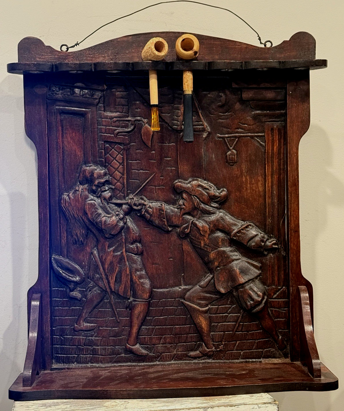 ANTIQUE WOODEN PIPE RACK TOBACCO SHELF W/ ORNATE HAND CARVED FIGHTING SCENE (EY
