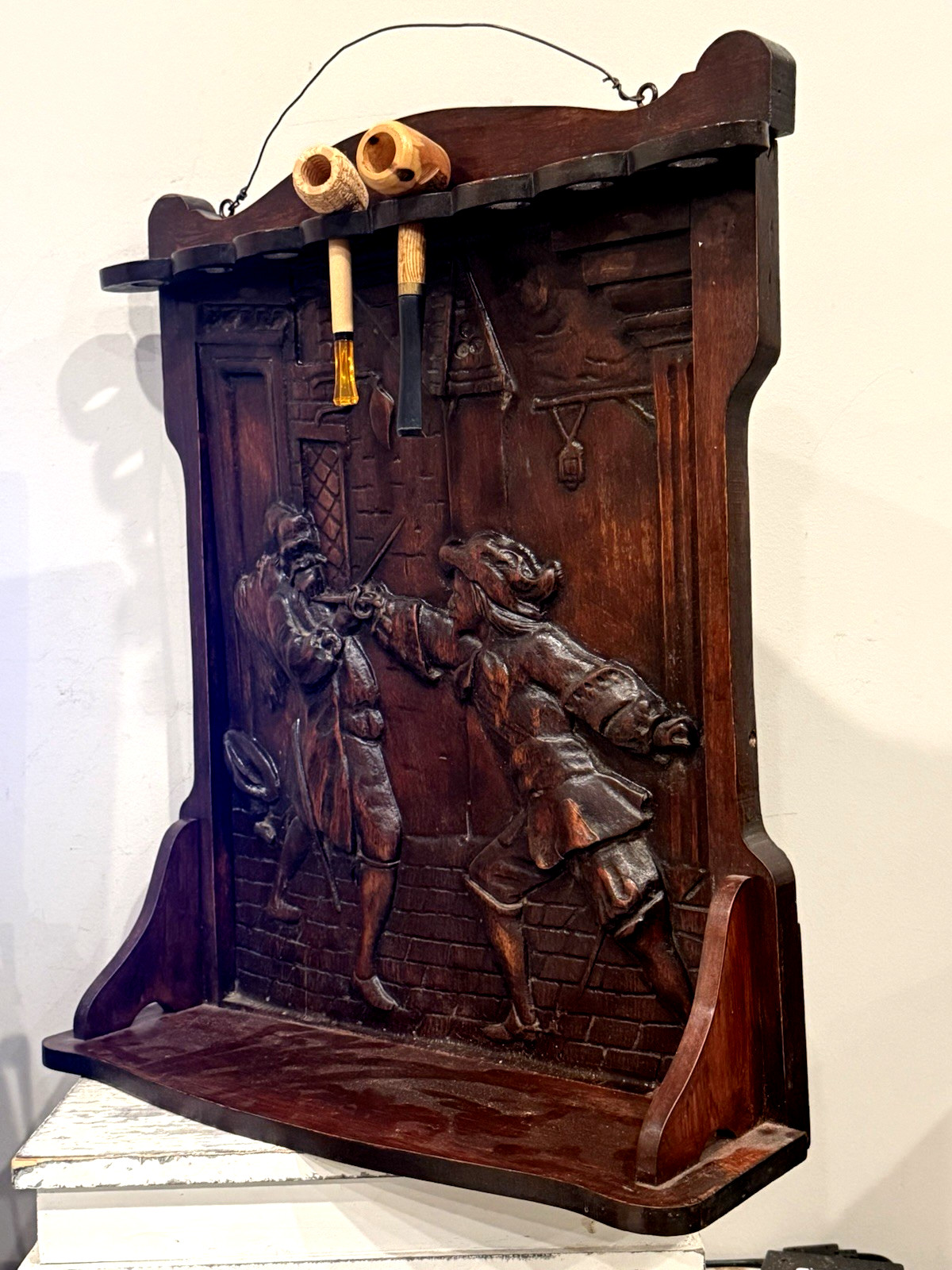 ANTIQUE WOODEN PIPE RACK TOBACCO SHELF W/ ORNATE HAND CARVED FIGHTING SCENE (EY