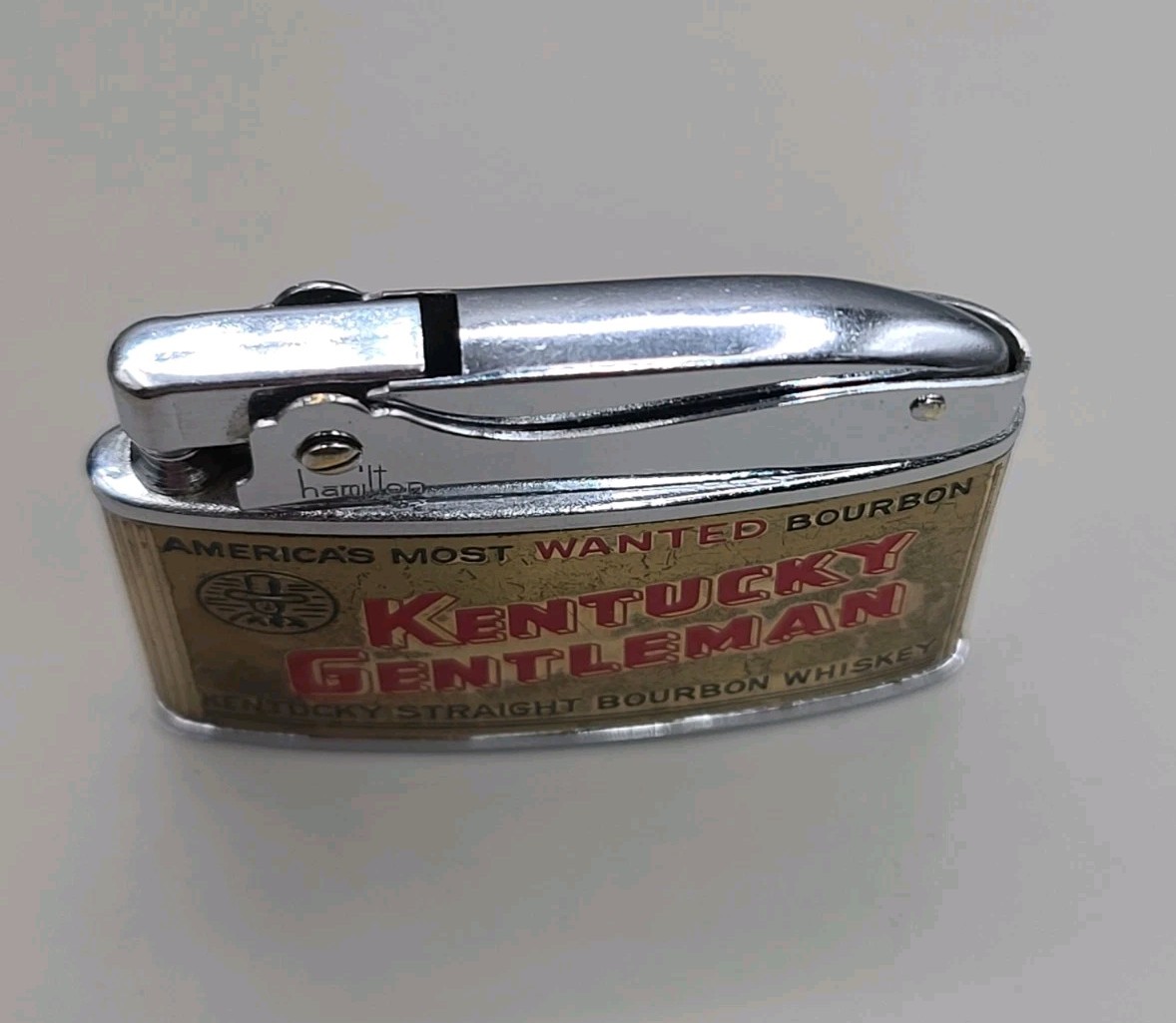 Vintage Kentucky Gentleman Bourbon America’s Most Wanted Flat Ad Petrol Lighter