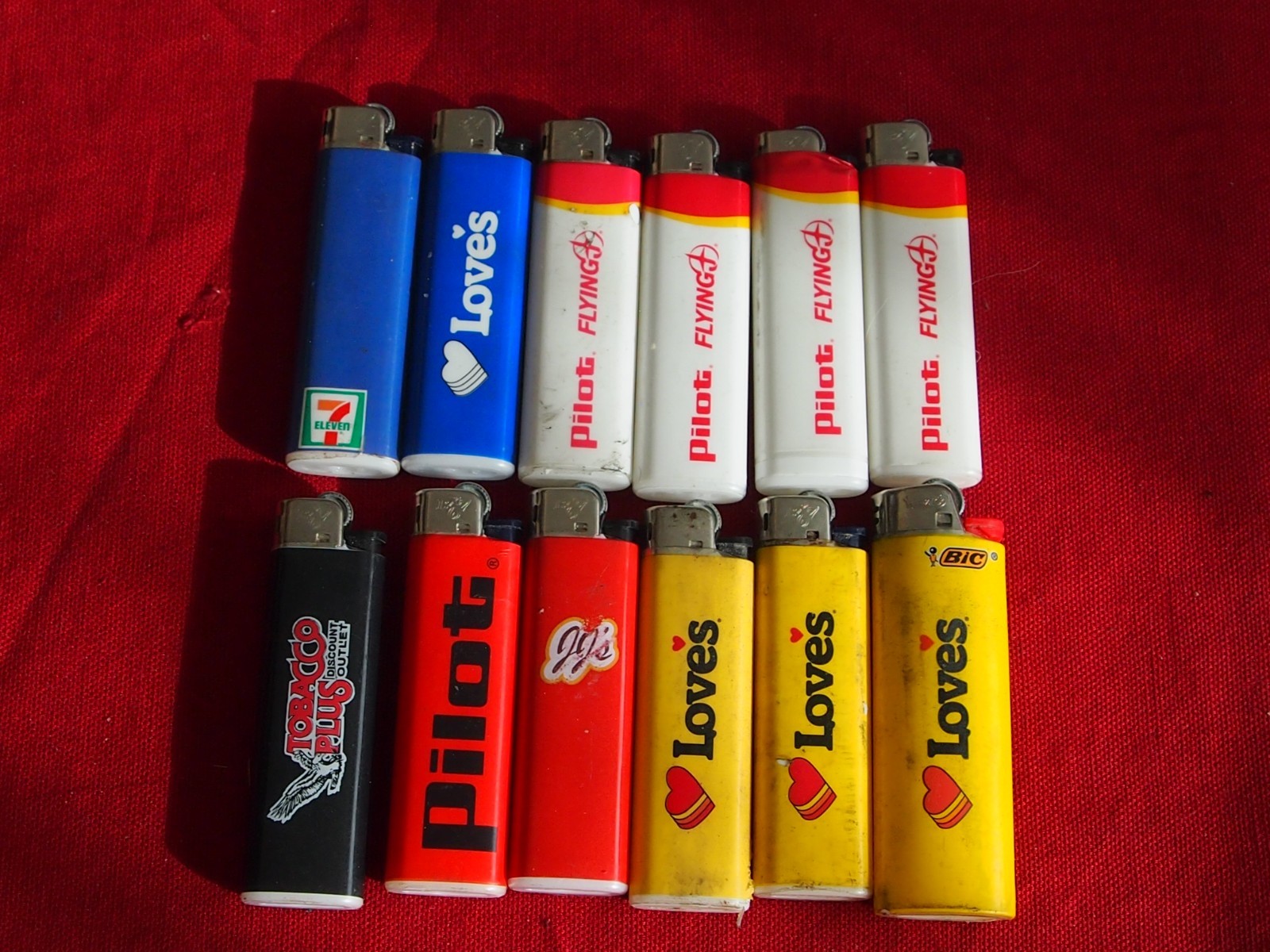 12 Lighters Color i Lighter Used but still working