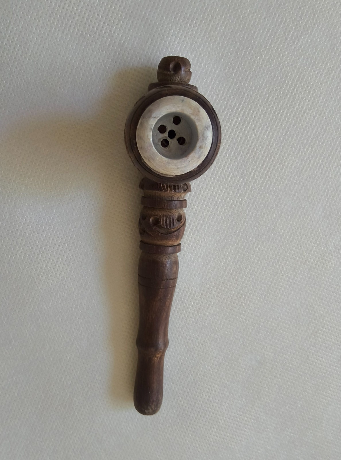 “Handcrafted Wooden Smoking Pipe with Intricate Carvings