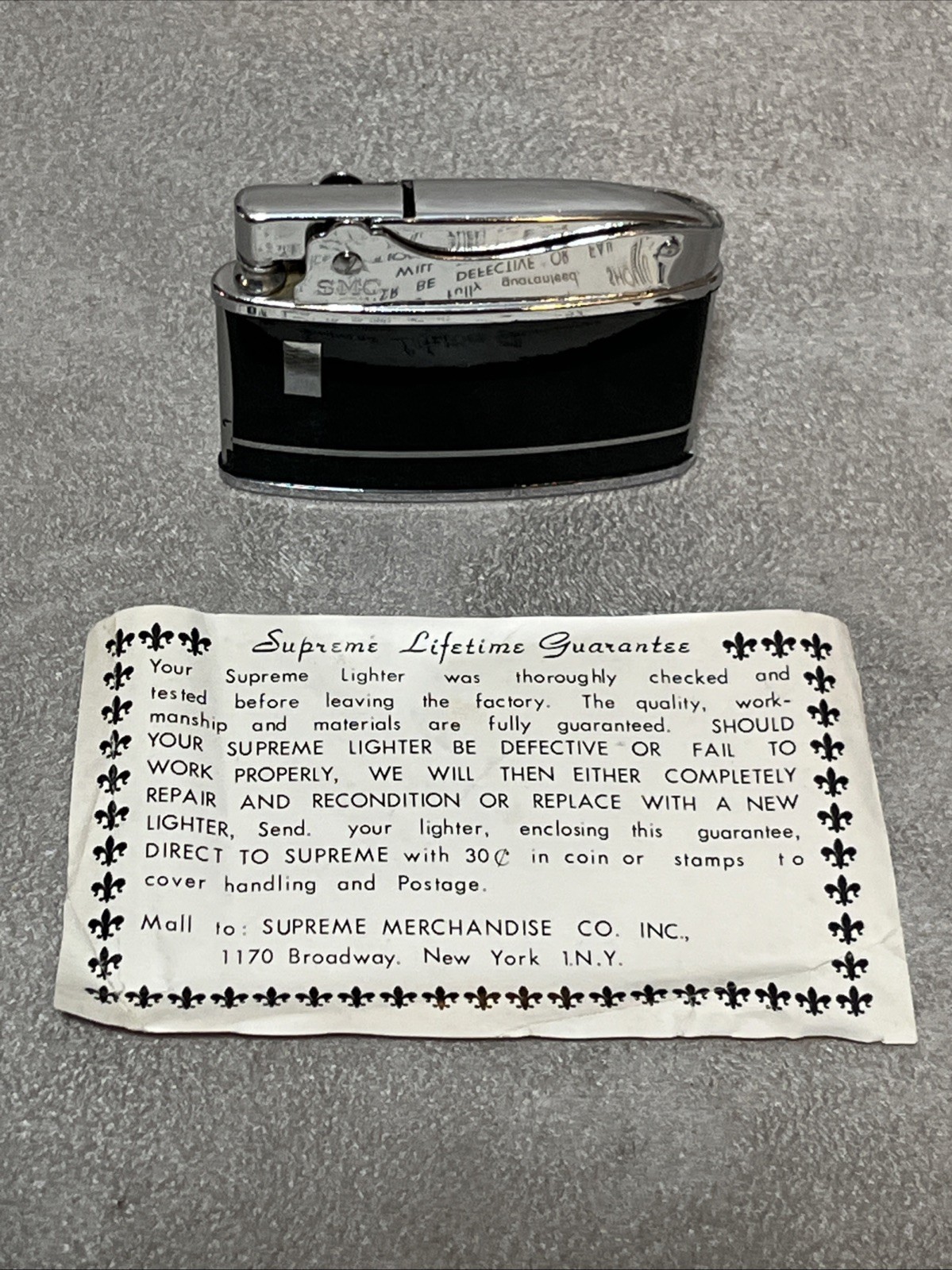 Vintage SMC Supreme slim/flat chrome & black enamel lighter. New old stock Works